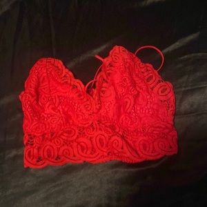 Vibrant red, laced, bralette with cross straps. Small